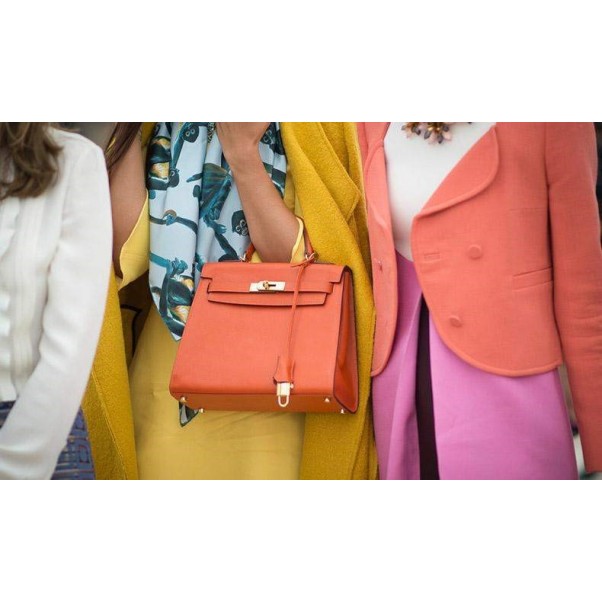 What does the handbag symbolize? INISESS